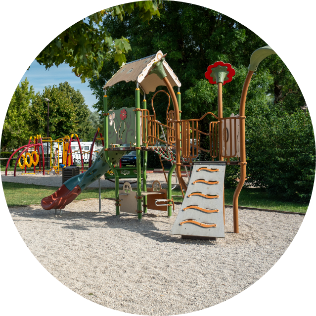 Play area for children at Les Bords de Loue campsite in Jura