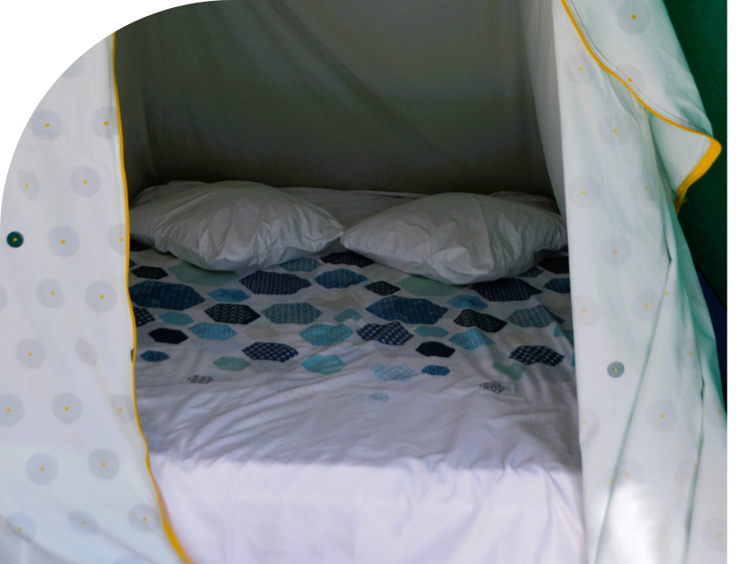 Bedroom in the canvas bungalow to rent at Les Bords de Loue campsite in Parcey