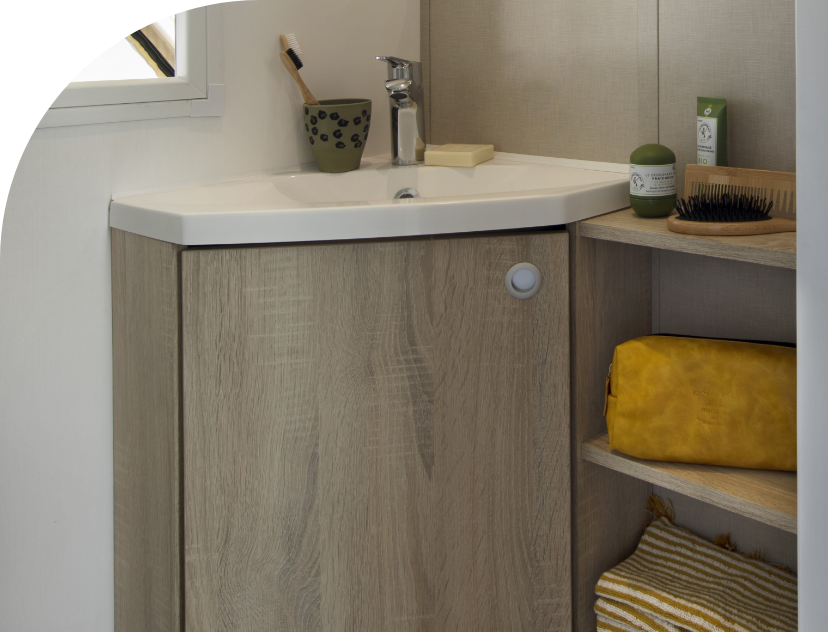 The bathroom in Coco Chrono with wash basin, original accommodation to rent at Les Bords de Loue campsite in the Bourgogne-Franche-Comté region